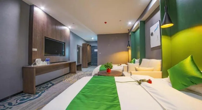 Bed in Shell Hotel Zhengzhou East High-Speed Railway Station Zhengdong Commerical Center