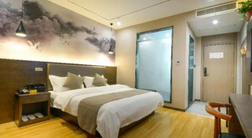 Bed in Shell Hotel Zhengzhou East High-Speed Railway Station Zhengdong Commerical Center