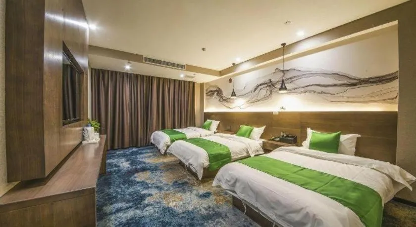 Bed in Shell Hotel Zhengzhou East High-Speed Railway Station Zhengdong Commerical Center