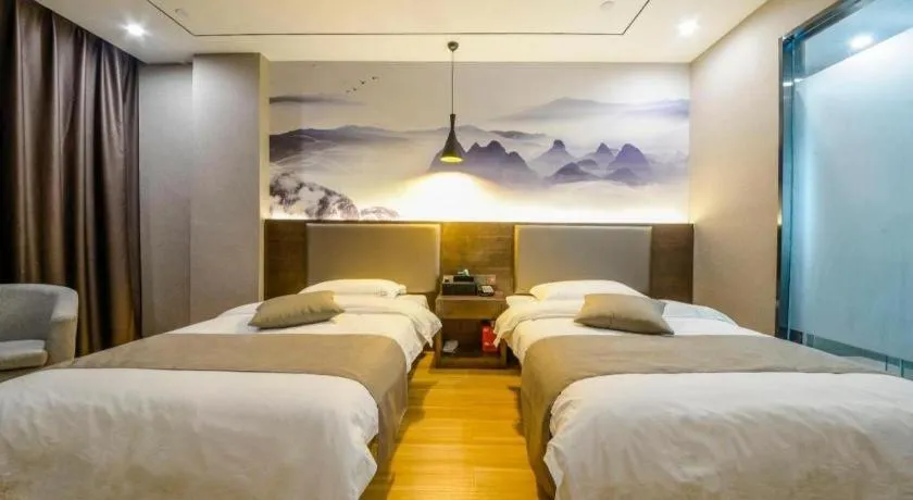 Bed in Shell Hotel Zhengzhou East High-Speed Railway Station Zhengdong Commerical Center