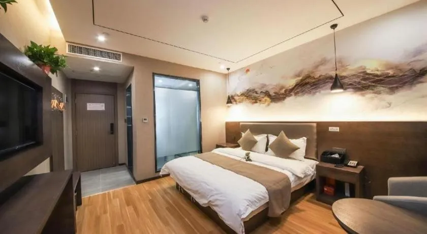 Bed in Shell Hotel Zhengzhou East High-Speed Railway Station Zhengdong Commerical Center