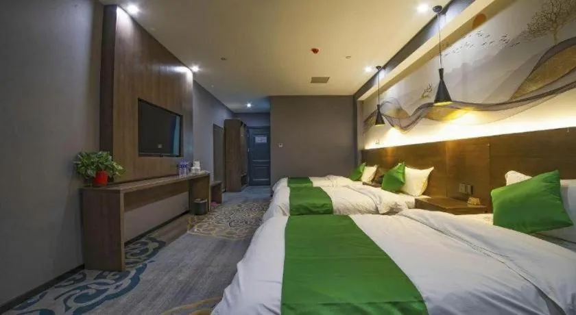 Bed in Shell Hotel Zhengzhou East High-Speed Railway Station Zhengdong Commerical Center