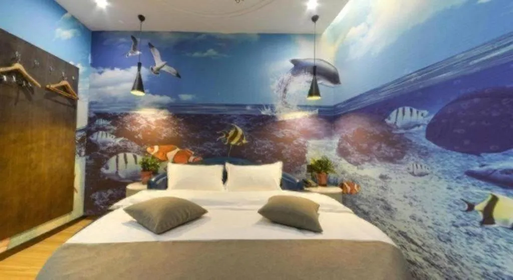 Bed in Shell Hotel Zhengzhou East High-Speed Railway Station Zhengdong Commerical Center