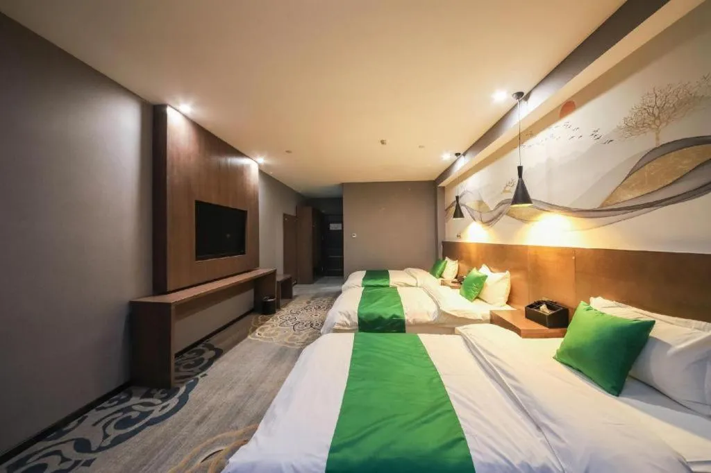 Bed in Shell Hotel Zhengzhou East High-Speed Railway Station Zhengdong Commerical Center