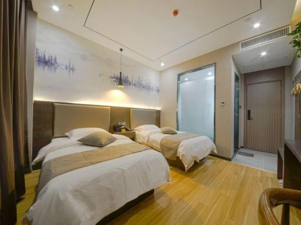 Bed in Shell Hotel Zhengzhou East High-Speed Railway Station Zhengdong Commerical Center