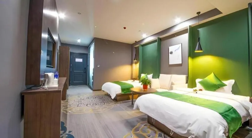Bed in Shell Hotel Zhengzhou East High-Speed Railway Station Zhengdong Commerical Center