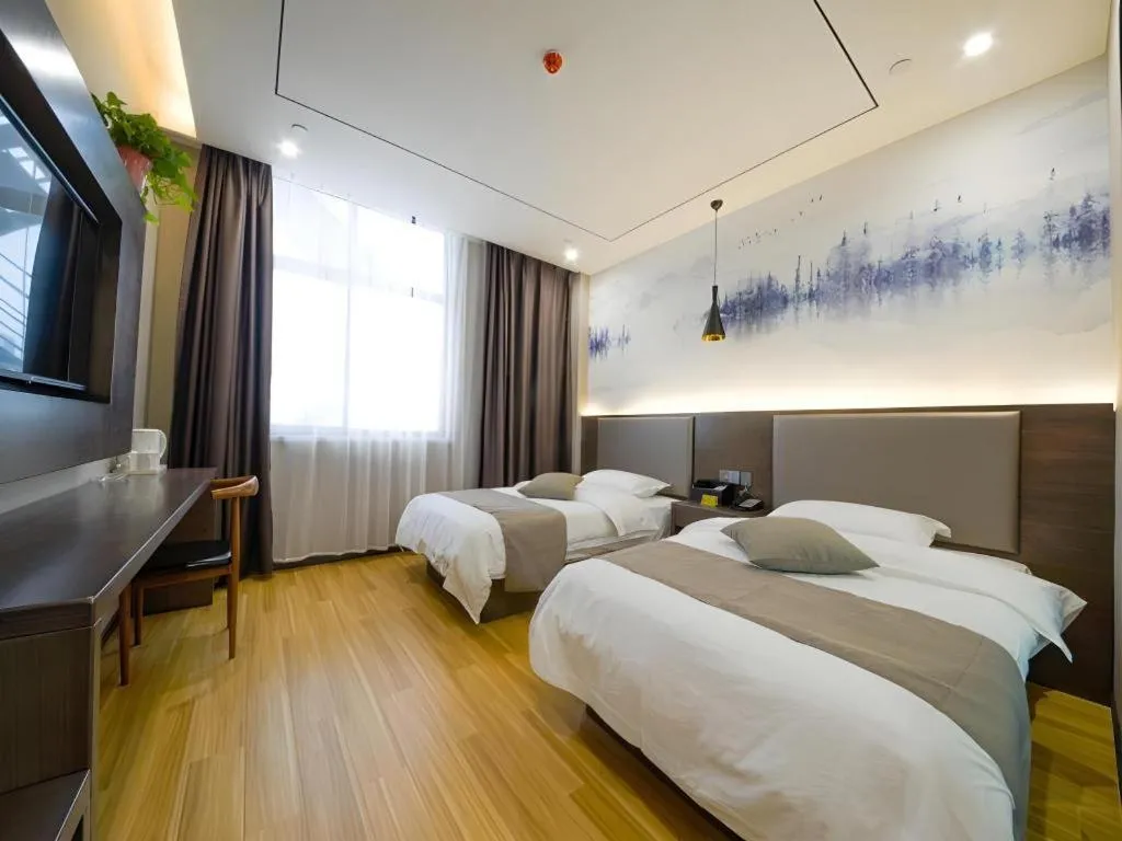 Bed in Shell Hotel Zhengzhou East High-Speed Railway Station Zhengdong Commerical Center