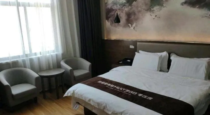 Bed in Shell Hotel Zhengzhou East High-Speed Railway Station Zhengdong Commerical Center