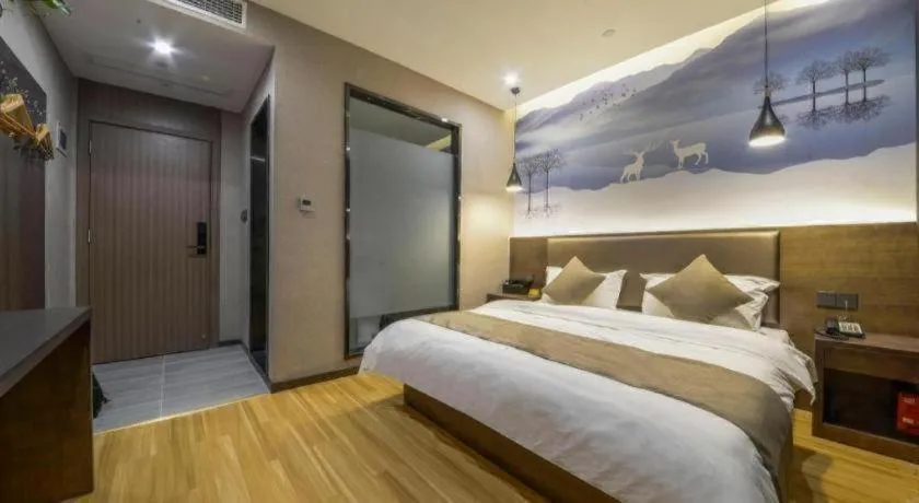 Bed in Shell Hotel Zhengzhou East High-Speed Railway Station Zhengdong Commerical Center