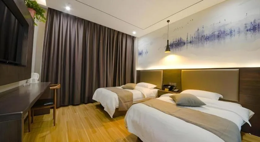 Bed in Shell Hotel Zhengzhou East High-Speed Railway Station Zhengdong Commerical Center