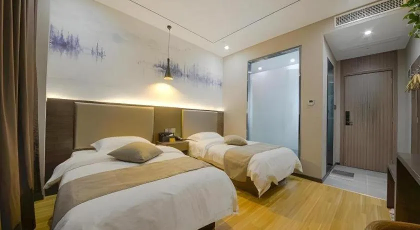 Bed in Shell Hotel Zhengzhou East High-Speed Railway Station Zhengdong Commerical Center