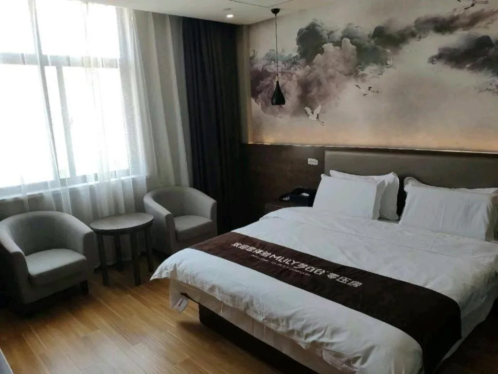 Bed in Shell Hotel Zhengzhou East High-Speed Railway Station Zhengdong Commerical Center