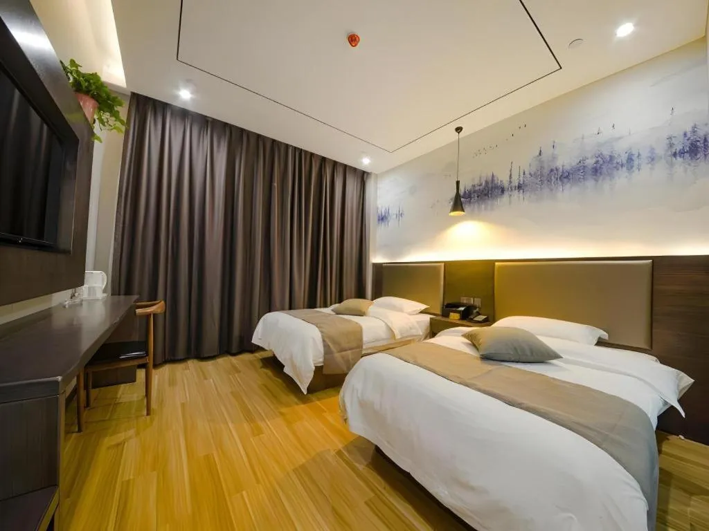 Bed in Shell Hotel Zhengzhou East High-Speed Railway Station Zhengdong Commerical Center
