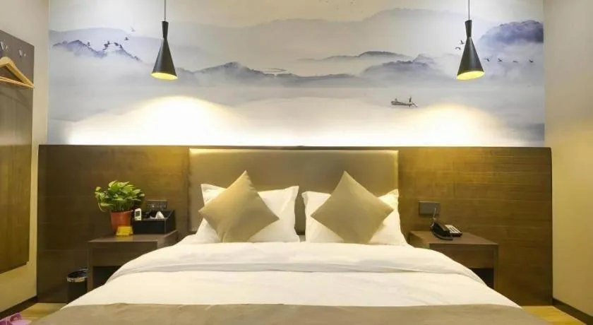 Bed in Shell Hotel Zhengzhou East High-Speed Railway Station Zhengdong Commerical Center