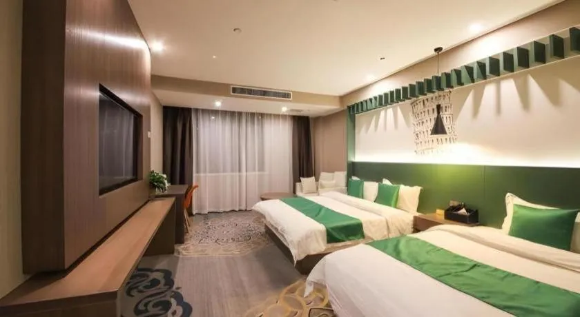 Bed in Shell Hotel Zhengzhou East High-Speed Railway Station Zhengdong Commerical Center