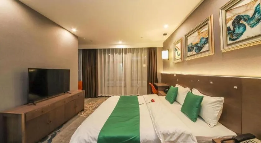 Bed in Shell Hotel Zhengzhou East High-Speed Railway Station Zhengdong Commerical Center