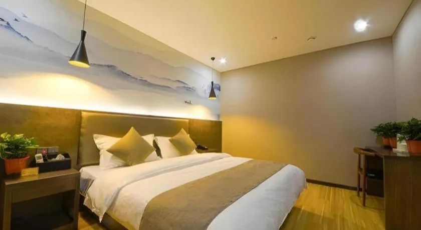 Bed in Shell Hotel Zhengzhou East High-Speed Railway Station Zhengdong Commerical Center