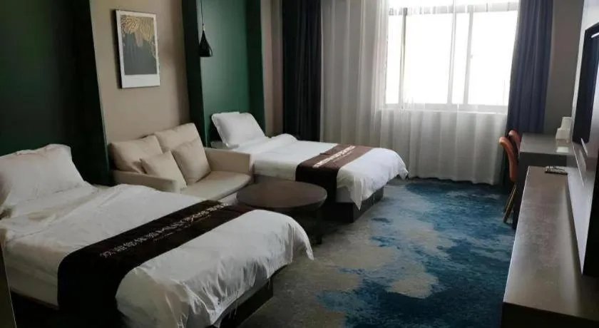 Bed in Shell Hotel Zhengzhou East High-Speed Railway Station Zhengdong Commerical Center
