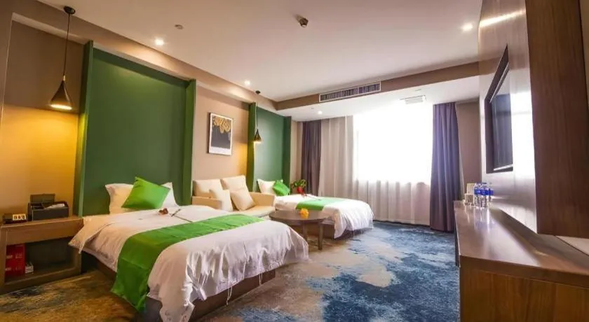 Bed in Shell Hotel Zhengzhou East High-Speed Railway Station Zhengdong Commerical Center