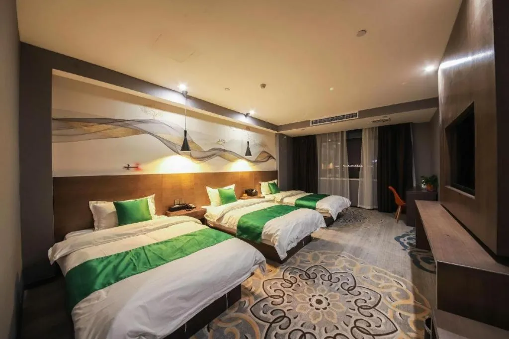 Bed in Shell Hotel Zhengzhou East High-Speed Railway Station Zhengdong Commerical Center