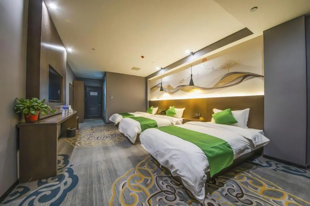 Bed in Shell Hotel Zhengzhou East High-Speed Railway Station Zhengdong Commerical Center