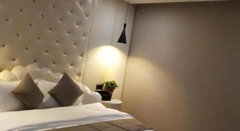 Bed in Shell Hotel Zhengzhou East High-Speed Railway Station Zhengdong Commerical Center