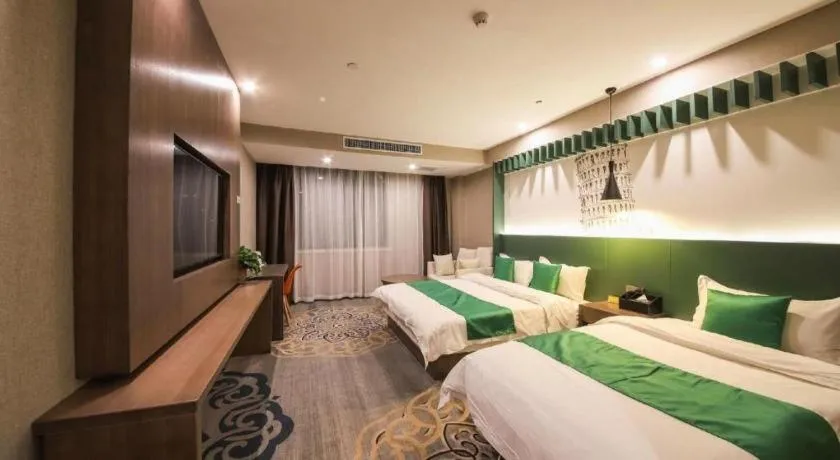 Bed in Shell Hotel Zhengzhou East High-Speed Railway Station Zhengdong Commerical Center