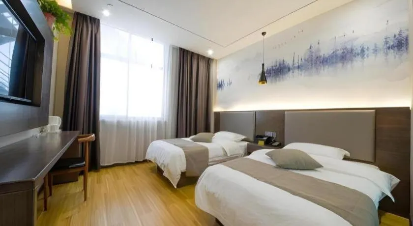 Bed in Shell Hotel Zhengzhou East High-Speed Railway Station Zhengdong Commerical Center
