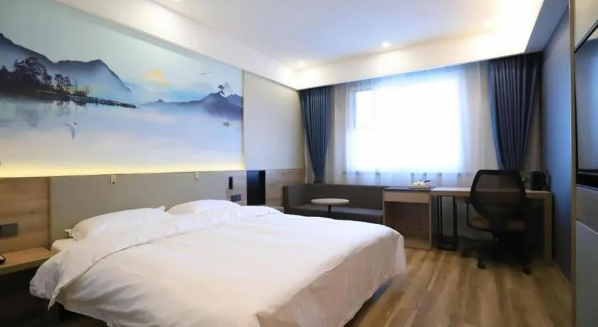 Bed in VX Hotel Jiangsu Taizhou Xinghua RT-Mart