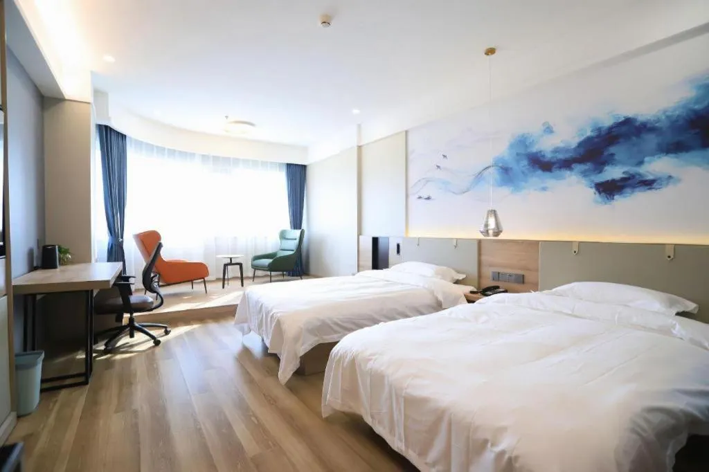 Bed in VX Hotel Jiangsu Taizhou Xinghua RT-Mart