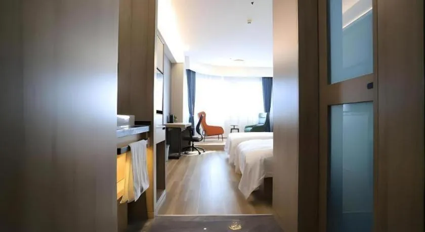 Bed in VX Hotel Jiangsu Taizhou Xinghua RT-Mart