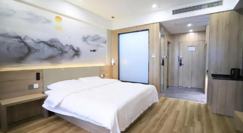 Bed in VX Hotel Jiangsu Taizhou Xinghua RT-Mart