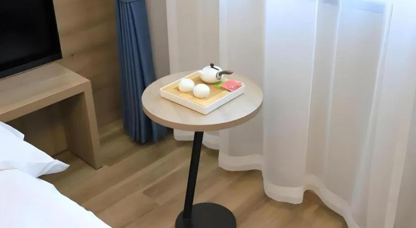 Bed in VX Hotel Jiangsu Taizhou Xinghua RT-Mart