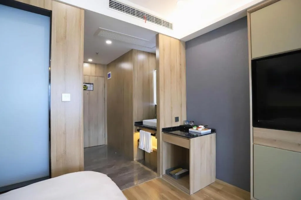 Bed in VX Hotel Jiangsu Taizhou Xinghua RT-Mart