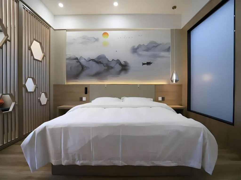 Bed in VX Hotel Jiangsu Taizhou Xinghua RT-Mart