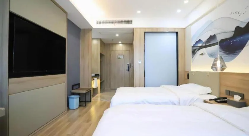 Bed in VX Hotel Jiangsu Taizhou Xinghua RT-Mart