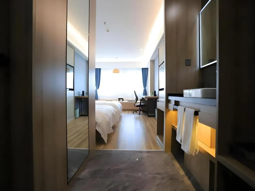 Bed in VX Hotel Jiangsu Taizhou Xinghua RT-Mart