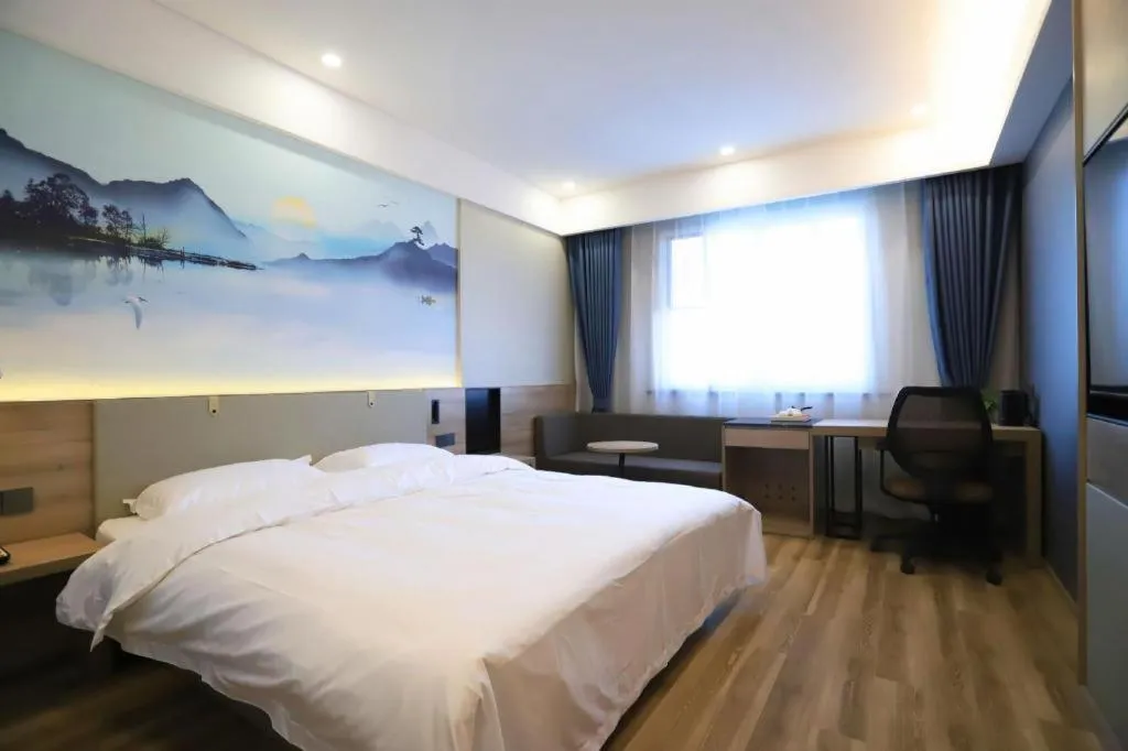 Bed in VX Hotel Jiangsu Taizhou Xinghua RT-Mart