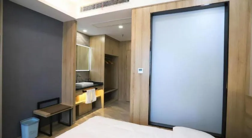 Bed in VX Hotel Jiangsu Taizhou Xinghua RT-Mart