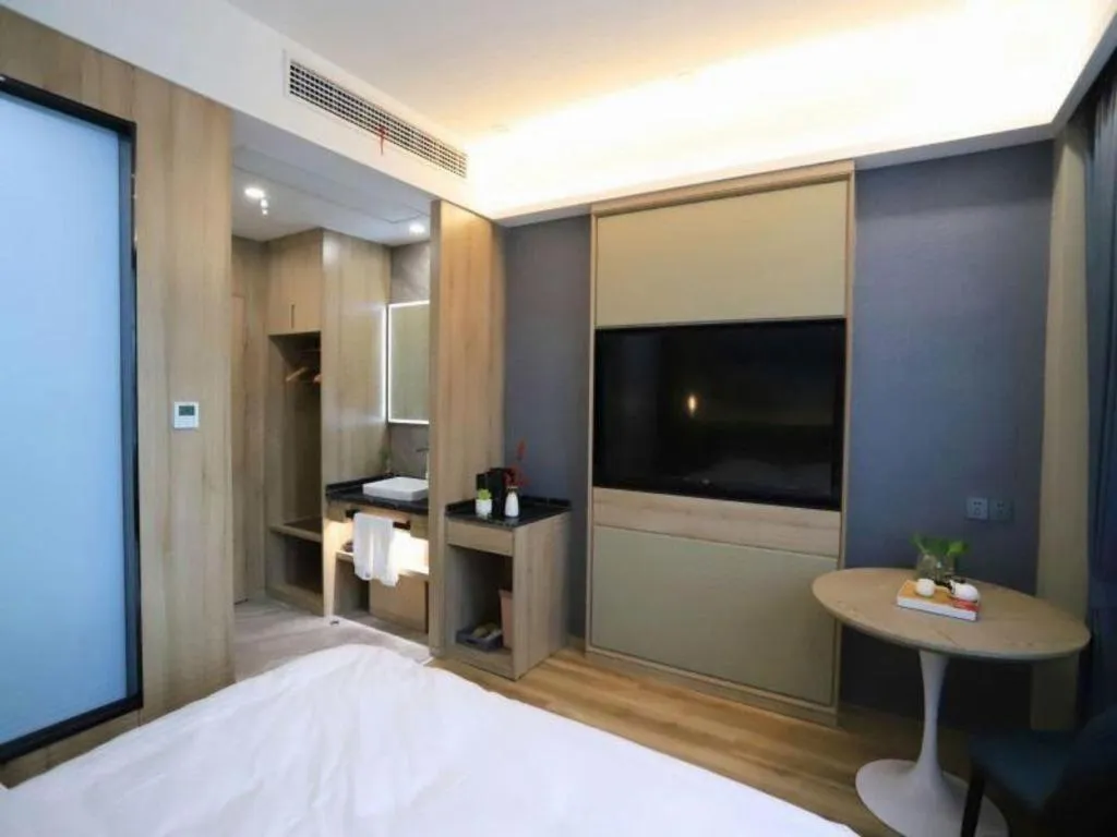 Bed in VX Hotel Jiangsu Taizhou Xinghua RT-Mart