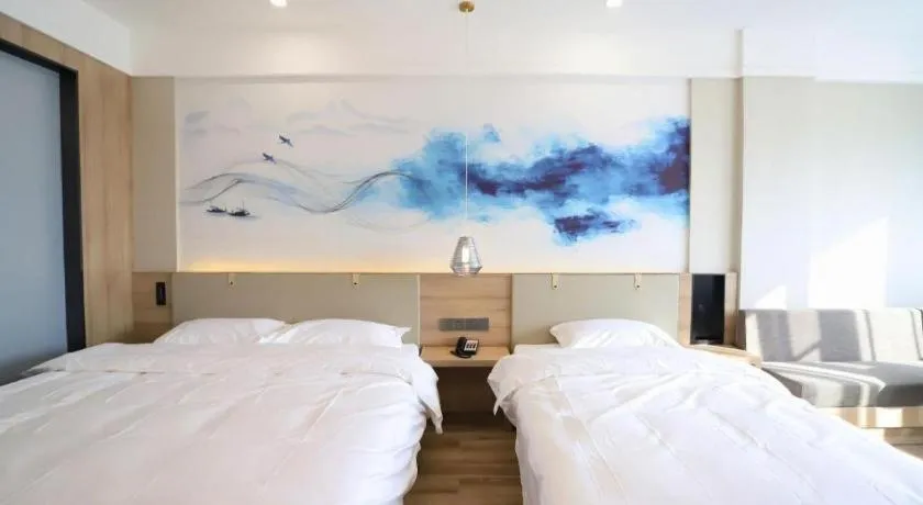 Bed in VX Hotel Jiangsu Taizhou Xinghua RT-Mart