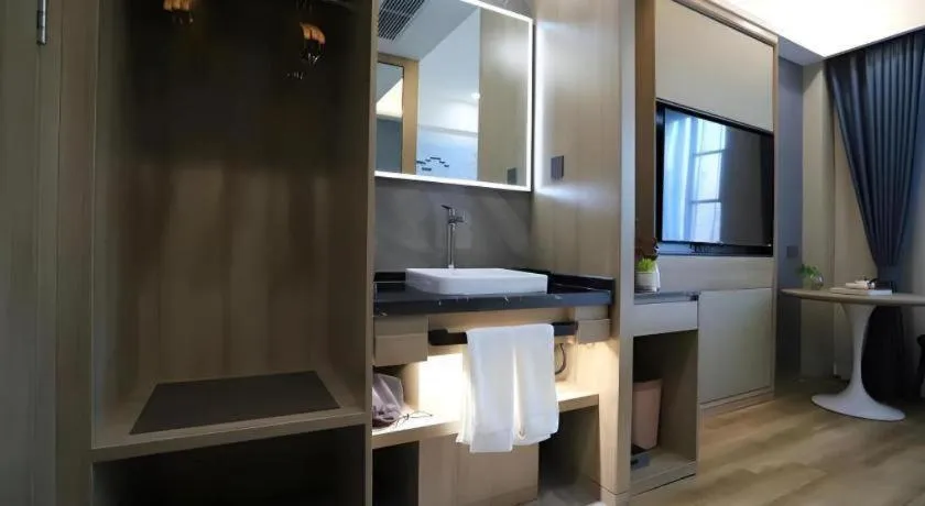 Bed in VX Hotel Jiangsu Taizhou Xinghua RT-Mart