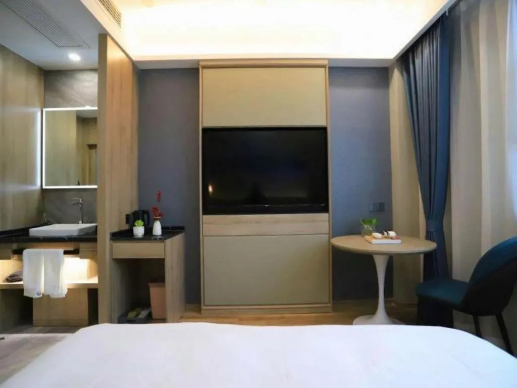 Bed in VX Hotel Jiangsu Taizhou Xinghua RT-Mart