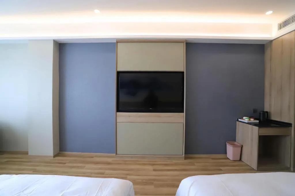 Bed in VX Hotel Jiangsu Taizhou Xinghua RT-Mart