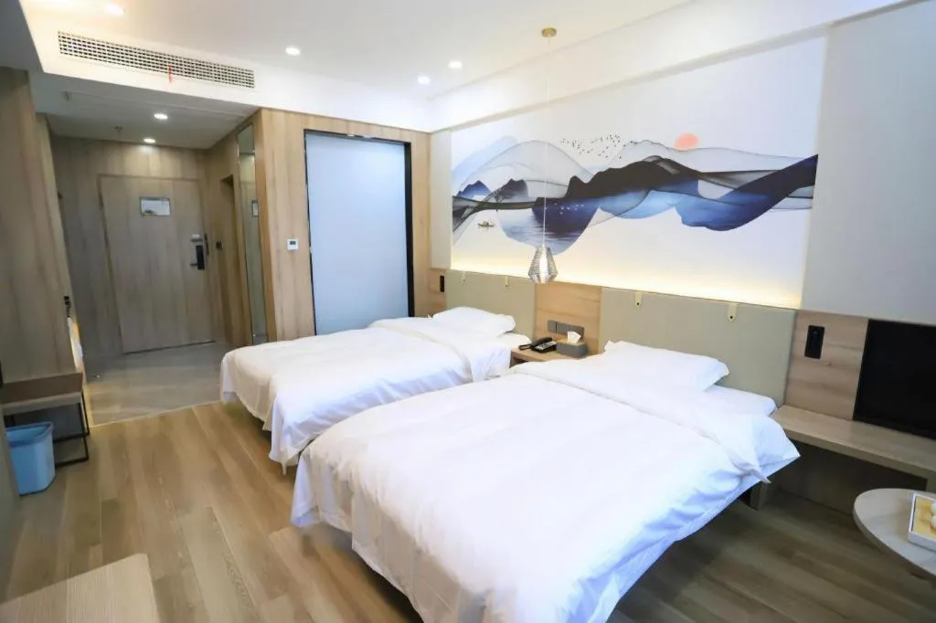 Bed in VX Hotel Jiangsu Taizhou Xinghua RT-Mart