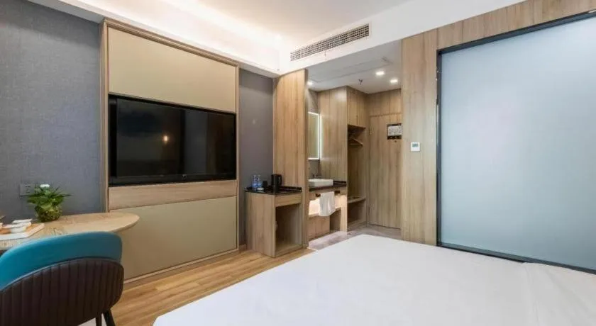 Bed in VX Hotel Jiangsu Taizhou Xinghua RT-Mart