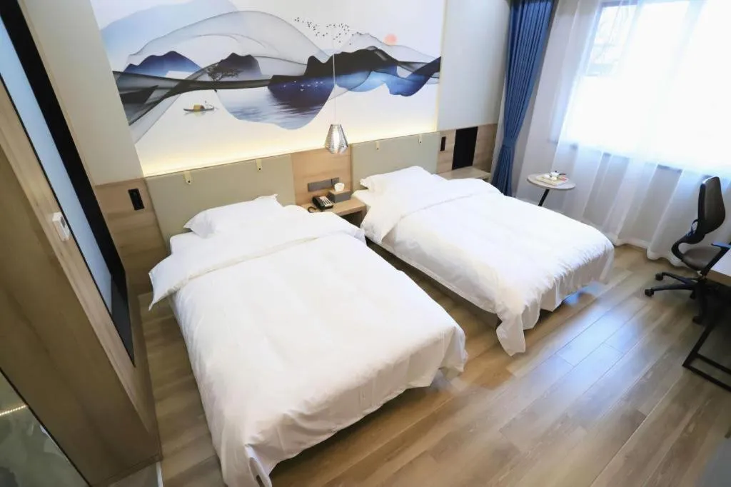 Bed in VX Hotel Jiangsu Taizhou Xinghua RT-Mart