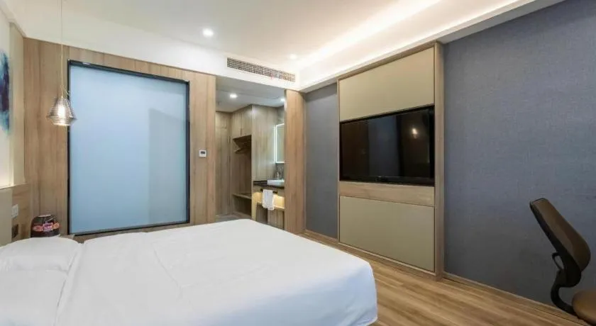 Bed in VX Hotel Jiangsu Taizhou Xinghua RT-Mart