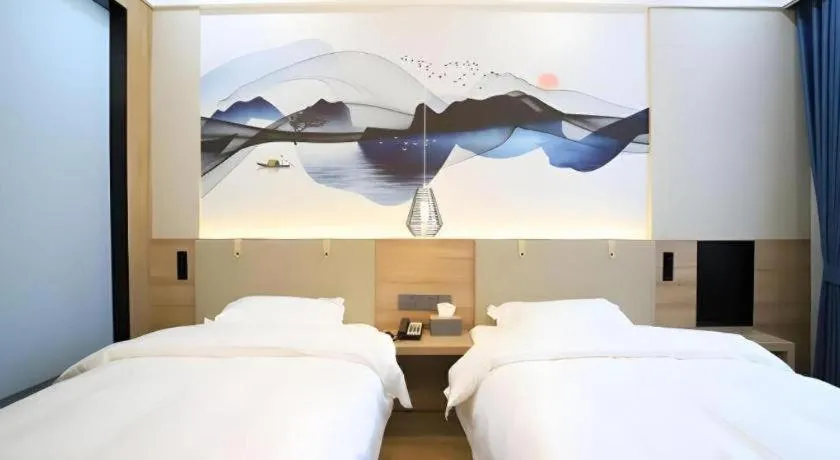 Bed in VX Hotel Jiangsu Taizhou Xinghua RT-Mart