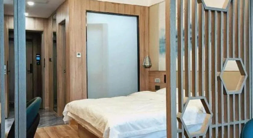 Bed in VX Hotel Jiangsu Taizhou Xinghua RT-Mart